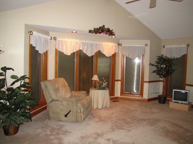 170 Montgomery Road Montgomery, IL 60538 - Photo 5 of 25 a living room with furniture flowers and a chandelier