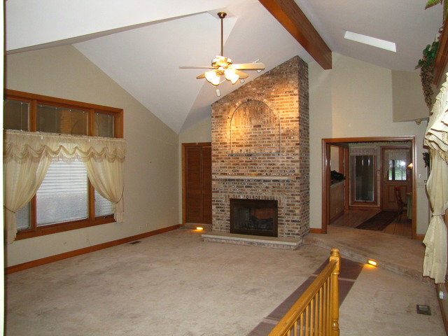 170 Montgomery Road Montgomery, IL 60538 - Photo 7 of 25 a living room with furniture and a fireplace