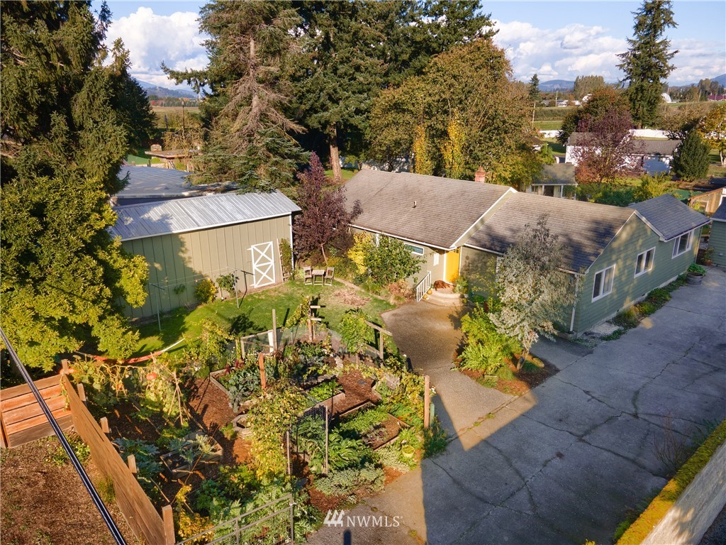 17932 Dunbar Road Mount Vernon, WA 98273 - Photo 4 of 39 a view of a house with a yard and garden
