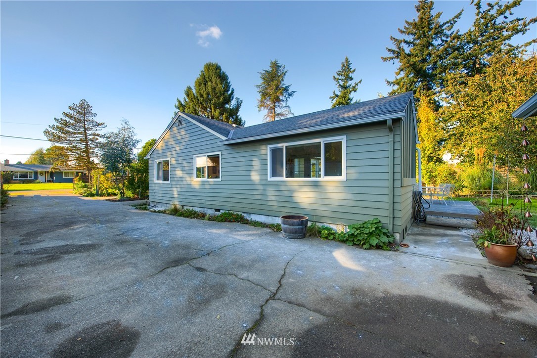 17932 Dunbar Road Mount Vernon, WA 98273 - Photo 35 of 39 a view of a house with a yard and potted plants