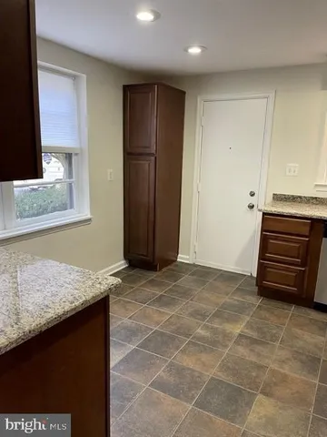 a view of entryway with kitchen