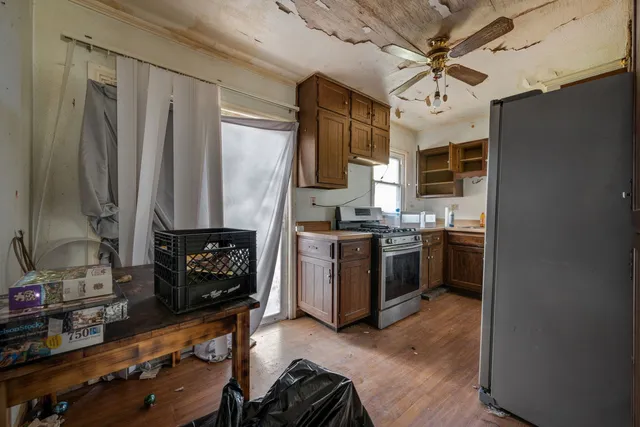 a kitchen with stainless steel appliances a stove cabinets and a sink