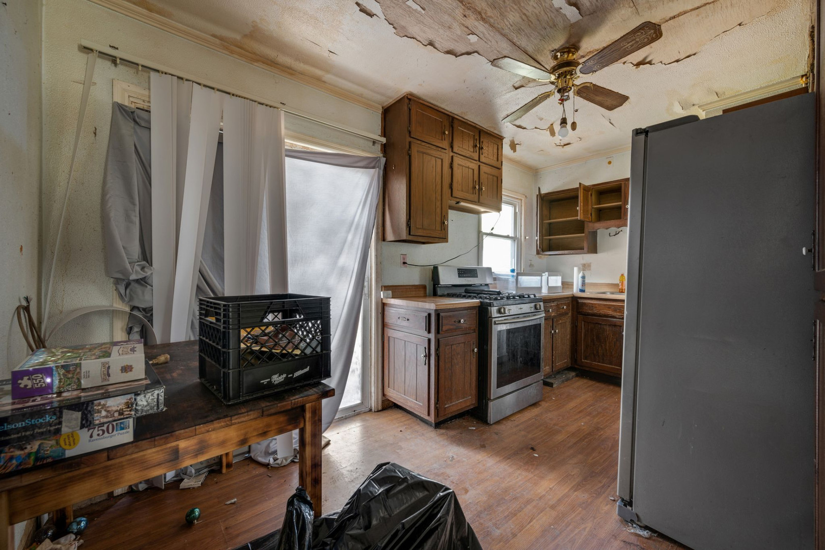 230 West Garfield Avenue Decatur, IL 62526 - Photo 16 of 34 a kitchen with stainless steel appliances a stove cabinets and a sink