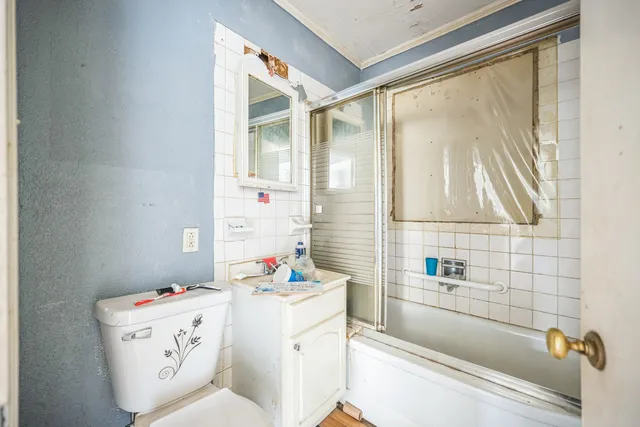 a bathroom with a bathtub sink and toilet