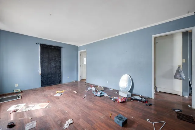 a bedroom with a bed and a view of bedroom