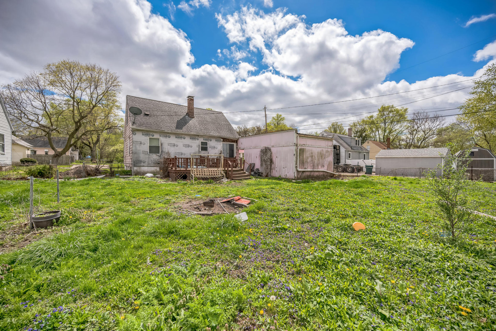 230 West Garfield Avenue Decatur, IL 62526 - Photo 6 of 34 a view of a house with a big yard and large trees