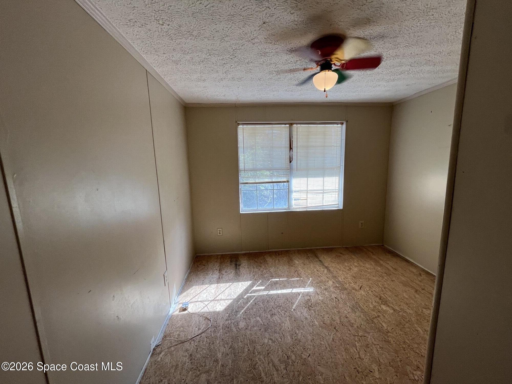 180 Rita Boulevard Melbourne Beach, FL 32951 - Photo 9 of 10 a view of an empty room with a window
