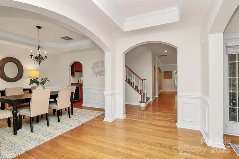 a kitchen with stainless steel appliances granite countertop a sink and a refrigerator