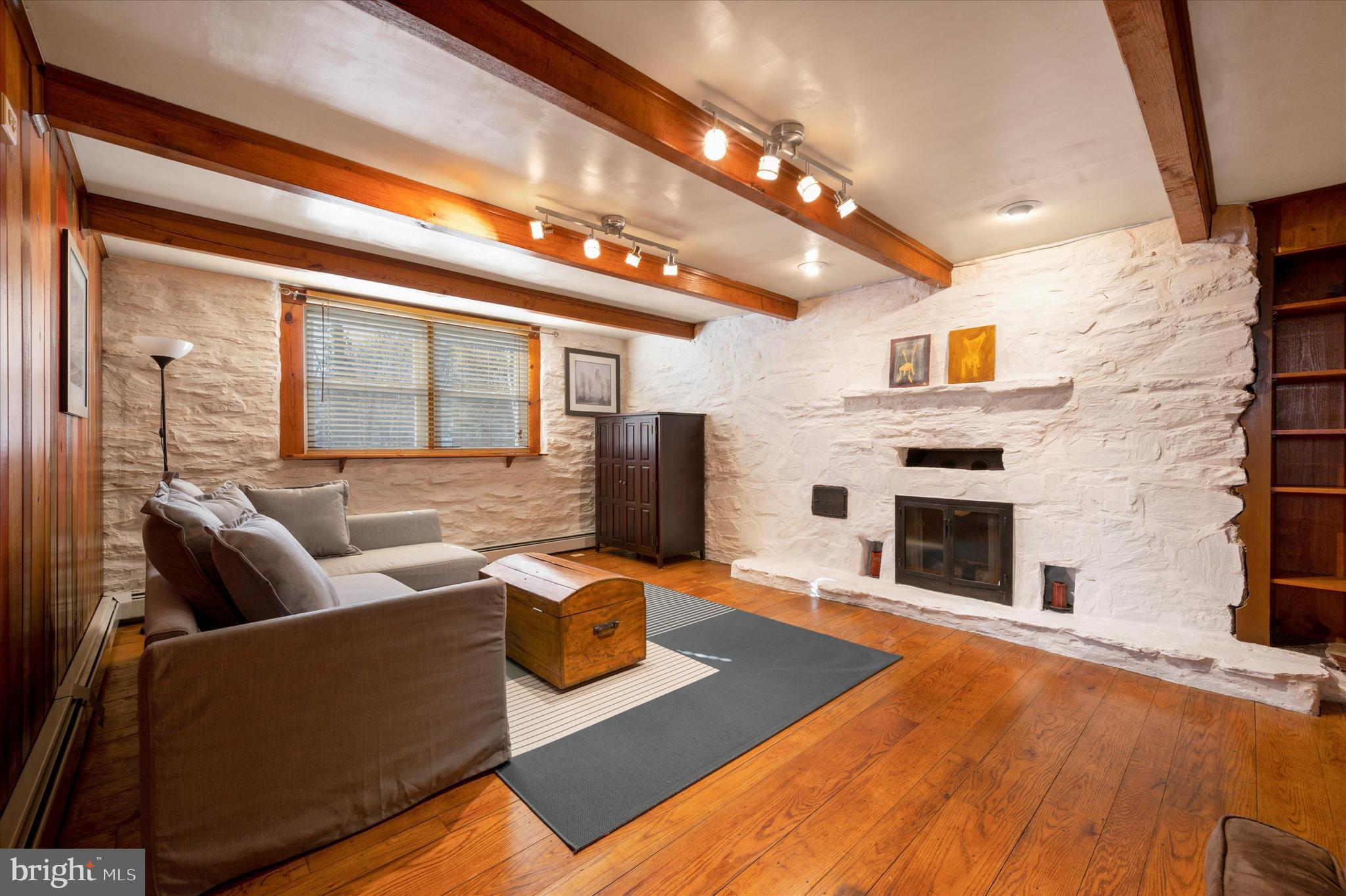700 Pine Ridge Road Media, PA 19063 - Photo 25 of 37 Family room in finished basement ft wood fireplace