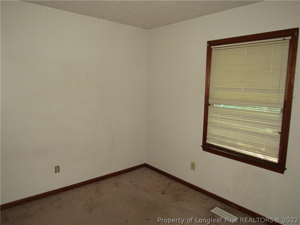 609 Jennings Farm Road Fayetteville, NC 28314 - Photo 5 of 6 a view of a small space with wooden floor and a window