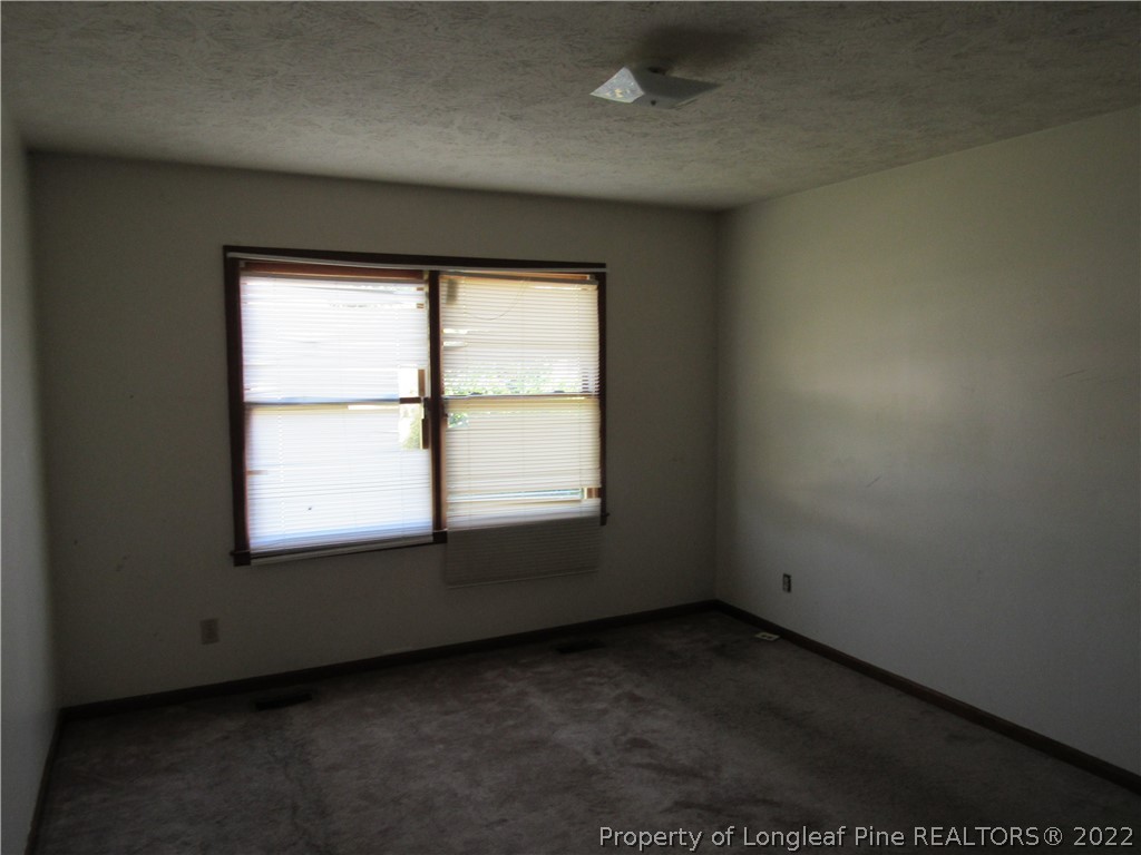 609 Jennings Farm Road Fayetteville, NC 28314 - Photo 6 of 6 an empty room with a window