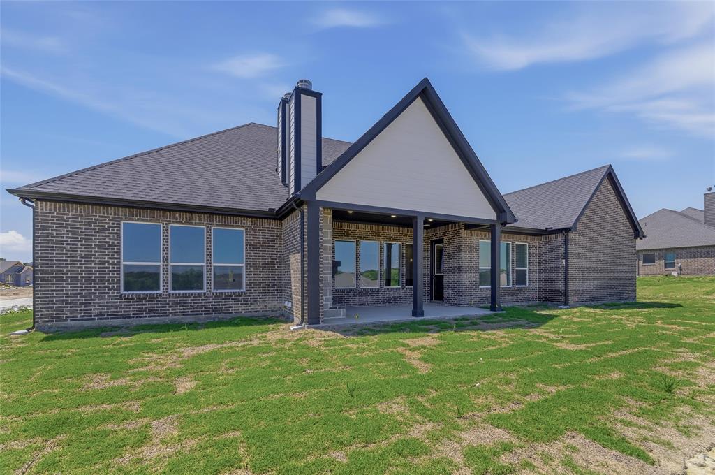 815 Vly Rdg Road Van Alstyne, TX 75495 - Photo 28 of 29 Modern brick exterior with dark shingle roofing