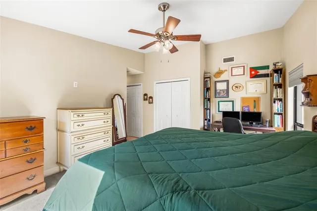 a bed room with a bed and closet