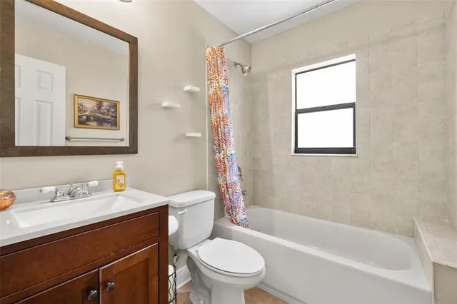 a bathroom with a sink a toilet and a bathtub