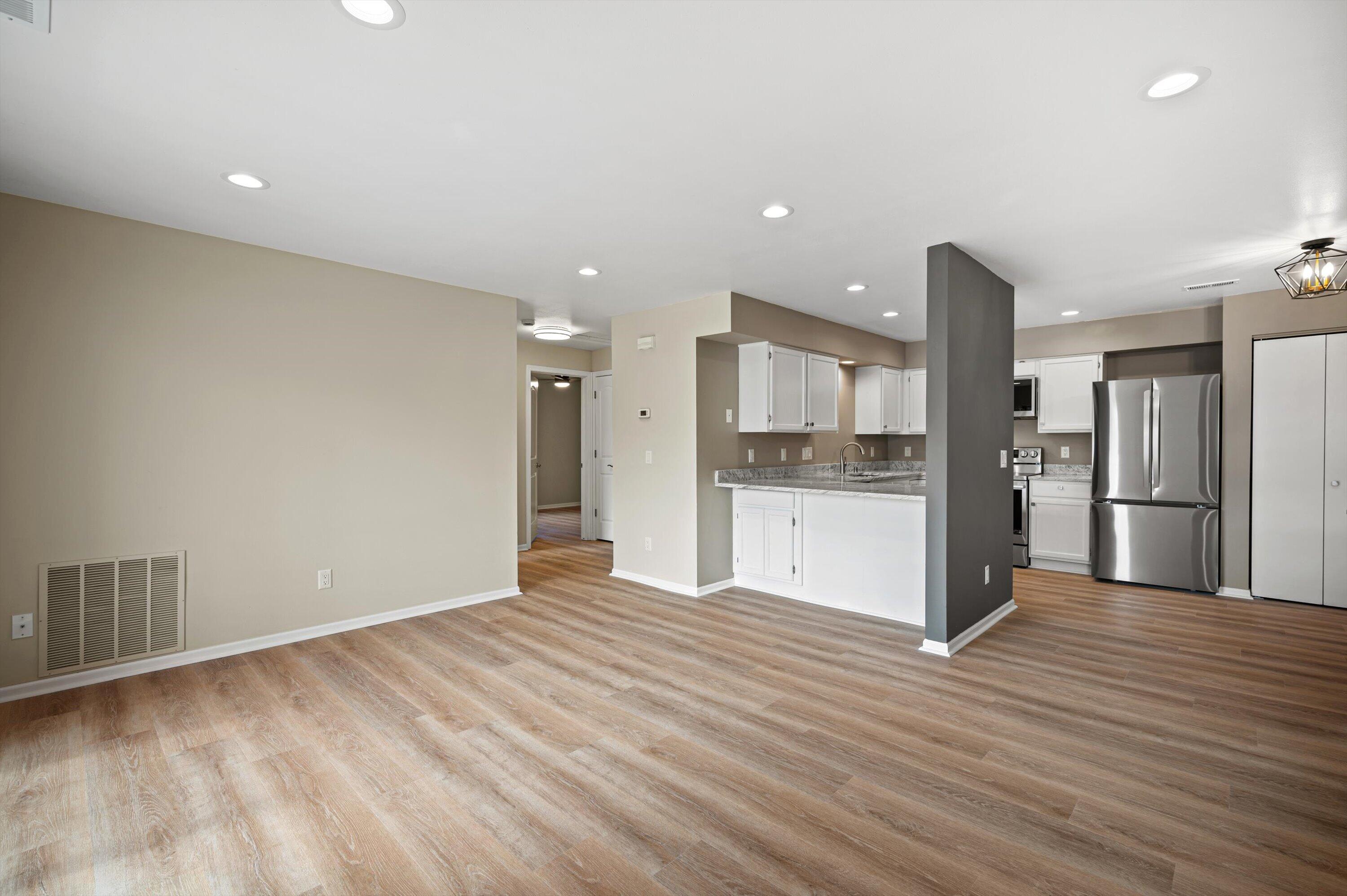 1848 Division Street, Unit 8 East Troy, WI 53120 - Photo 7 of 24 07-High Quality LVP Flooring
