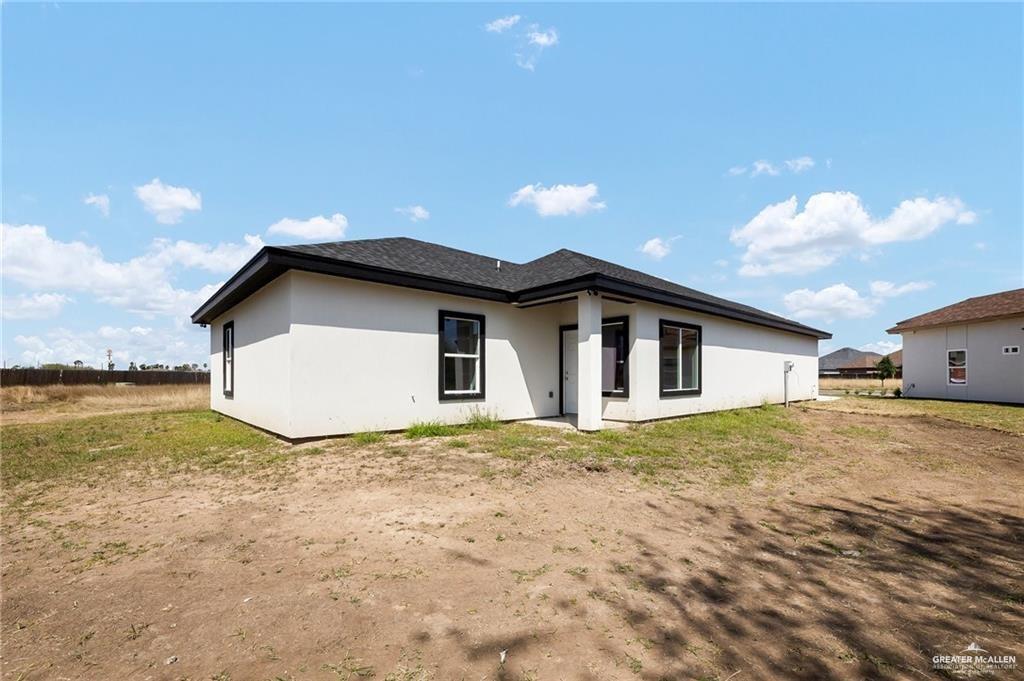 3708 Canan Street Weslaco, TX 78596 - Photo 12 of 13 a view of a house with pool and a yard