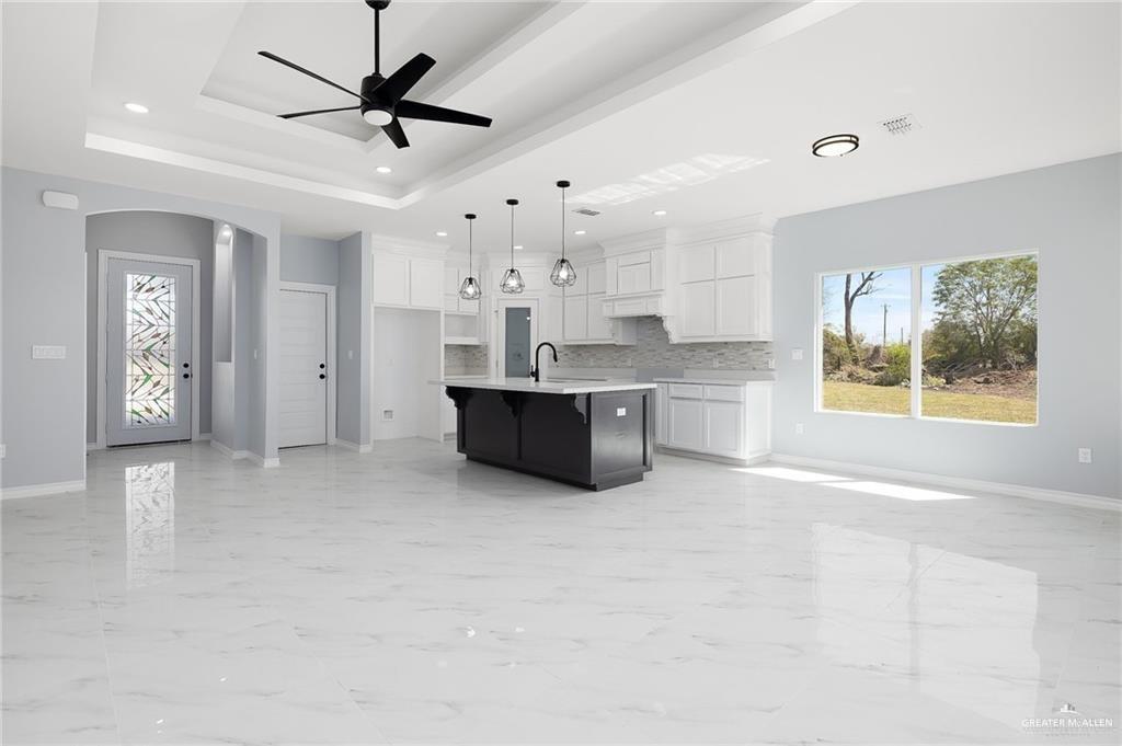 3708 Canan Street Weslaco, TX 78596 - Photo 2 of 13 a view of a kitchen with microwave and cabinets