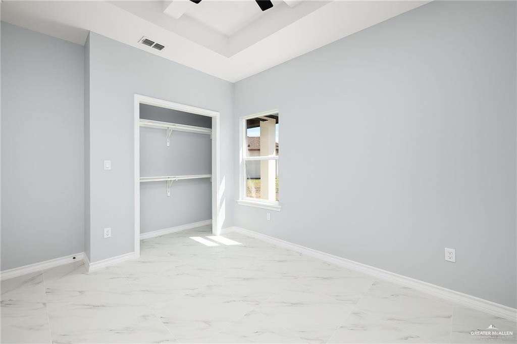 3708 Canan Street Weslaco, TX 78596 - Photo 8 of 13 a view of an empty room with closet and a window