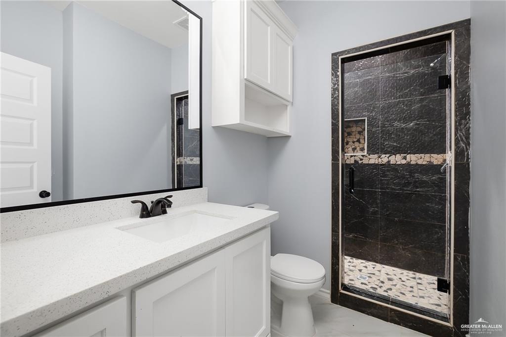 3708 Canan Street Weslaco, TX 78596 - Photo 9 of 13 a bathroom with a sink and a mirror