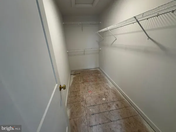 a bathroom with a sink a toilet a mirror and shower