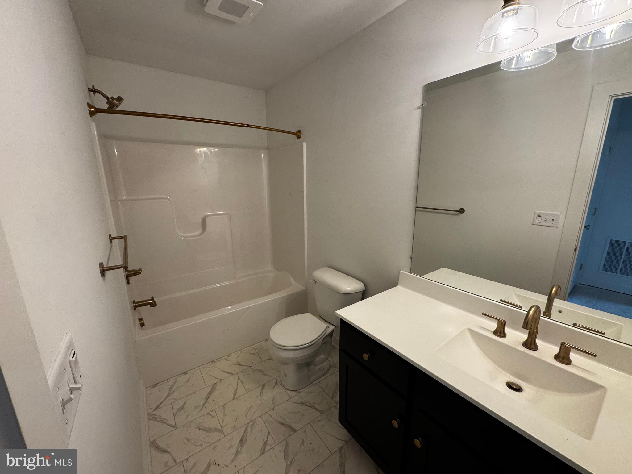 185 Trailside Court Lebanon, PA 17042 - Photo 15 of 17 a bathroom with a sink a toilet a mirror and shower
