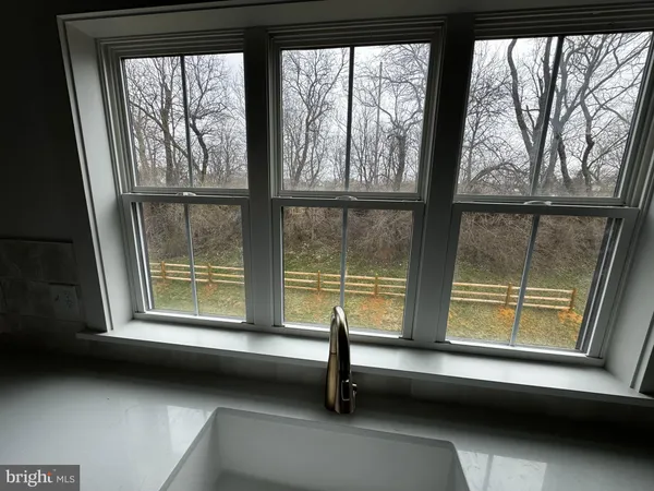 a view of a window and lake in back