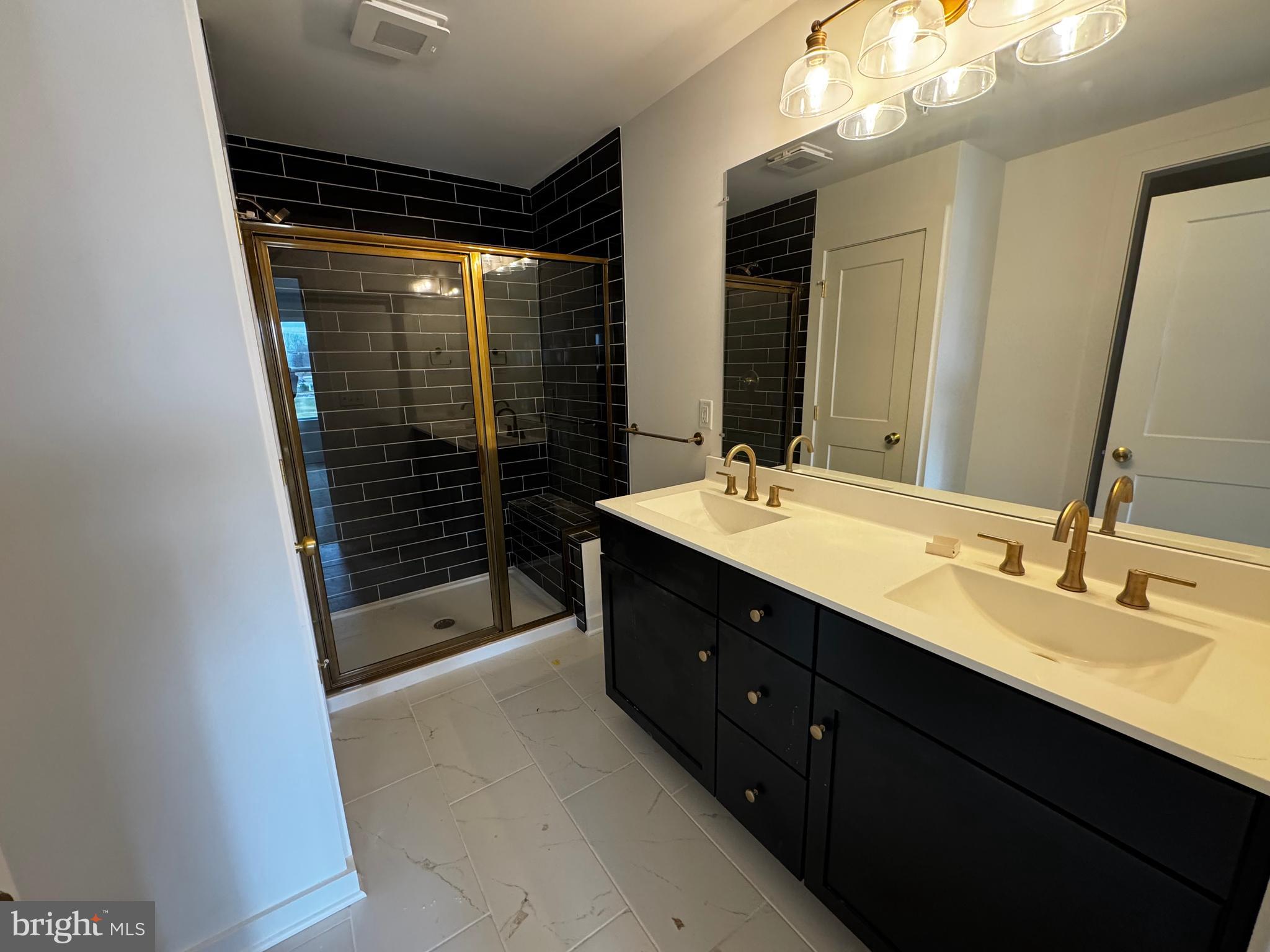 185 Trailside Court Lebanon, PA 17042 - Photo 9 of 17 a bathroom with a sink vanity and a mirror