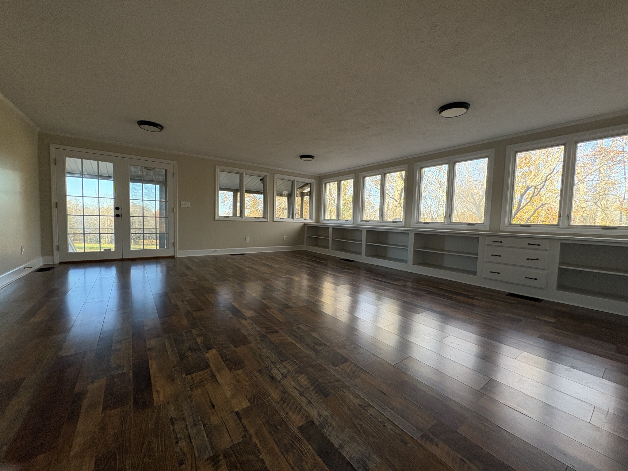298 Leonard Jackson Road Waynesboro, TN 38485 - Photo 16 of 100 an empty room with wooden floor and windows