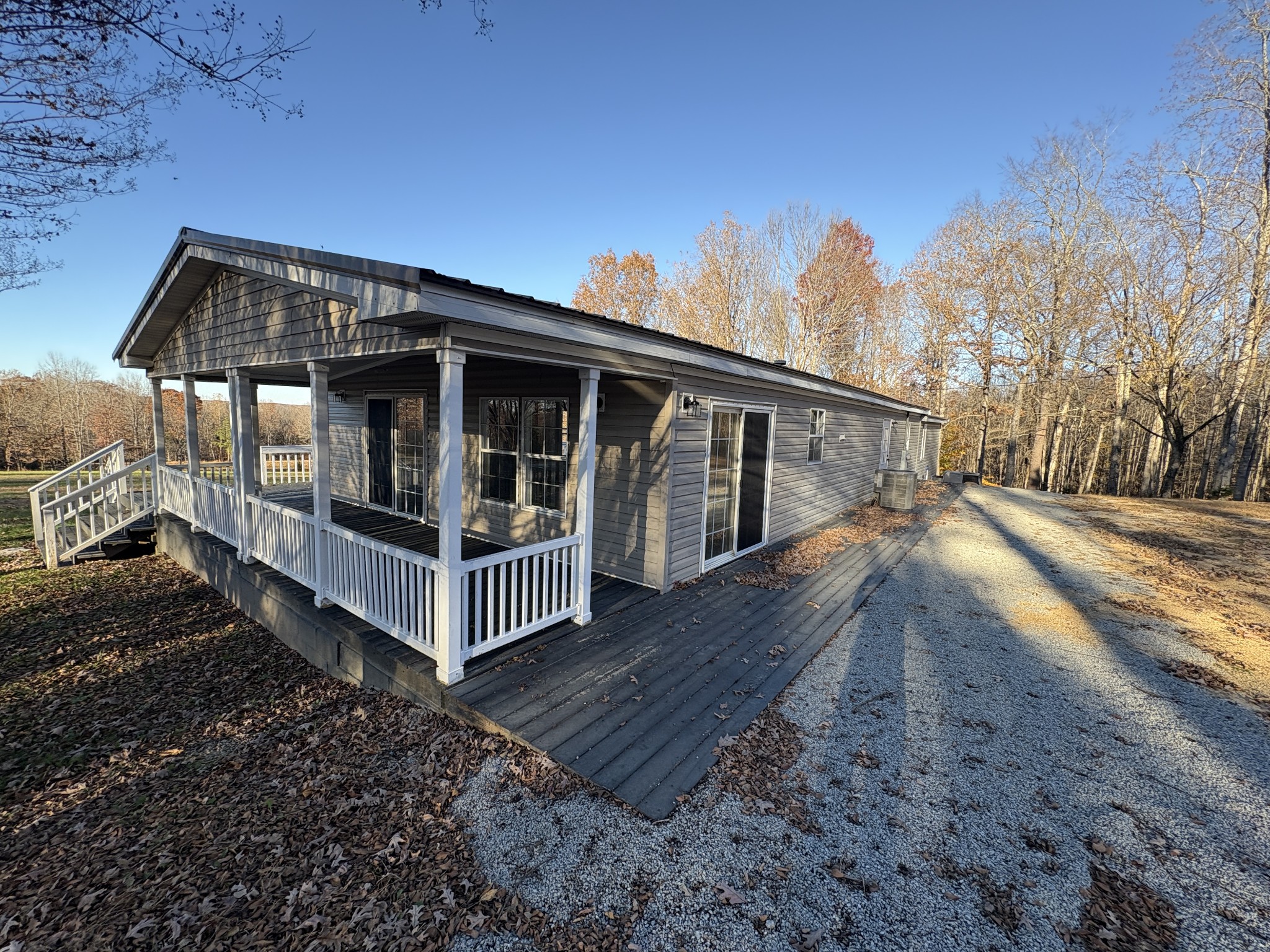 298 Leonard Jackson Road Waynesboro, TN 38485 - Photo 3 of 100 a view of a house with wooden floor next to a yard