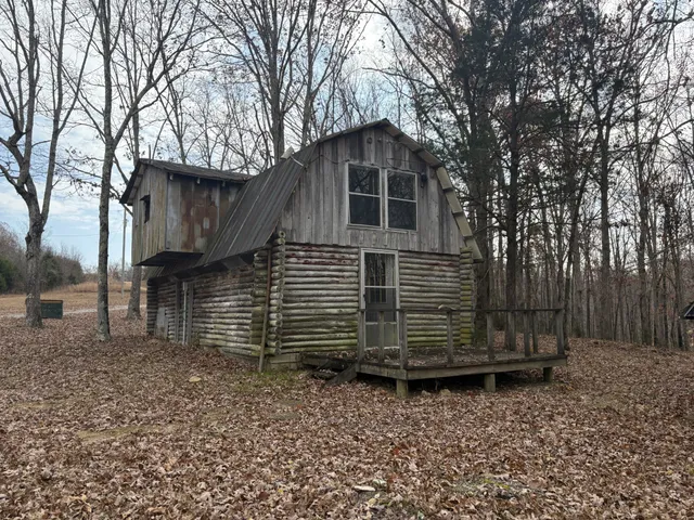 a view of a backyard of the house
