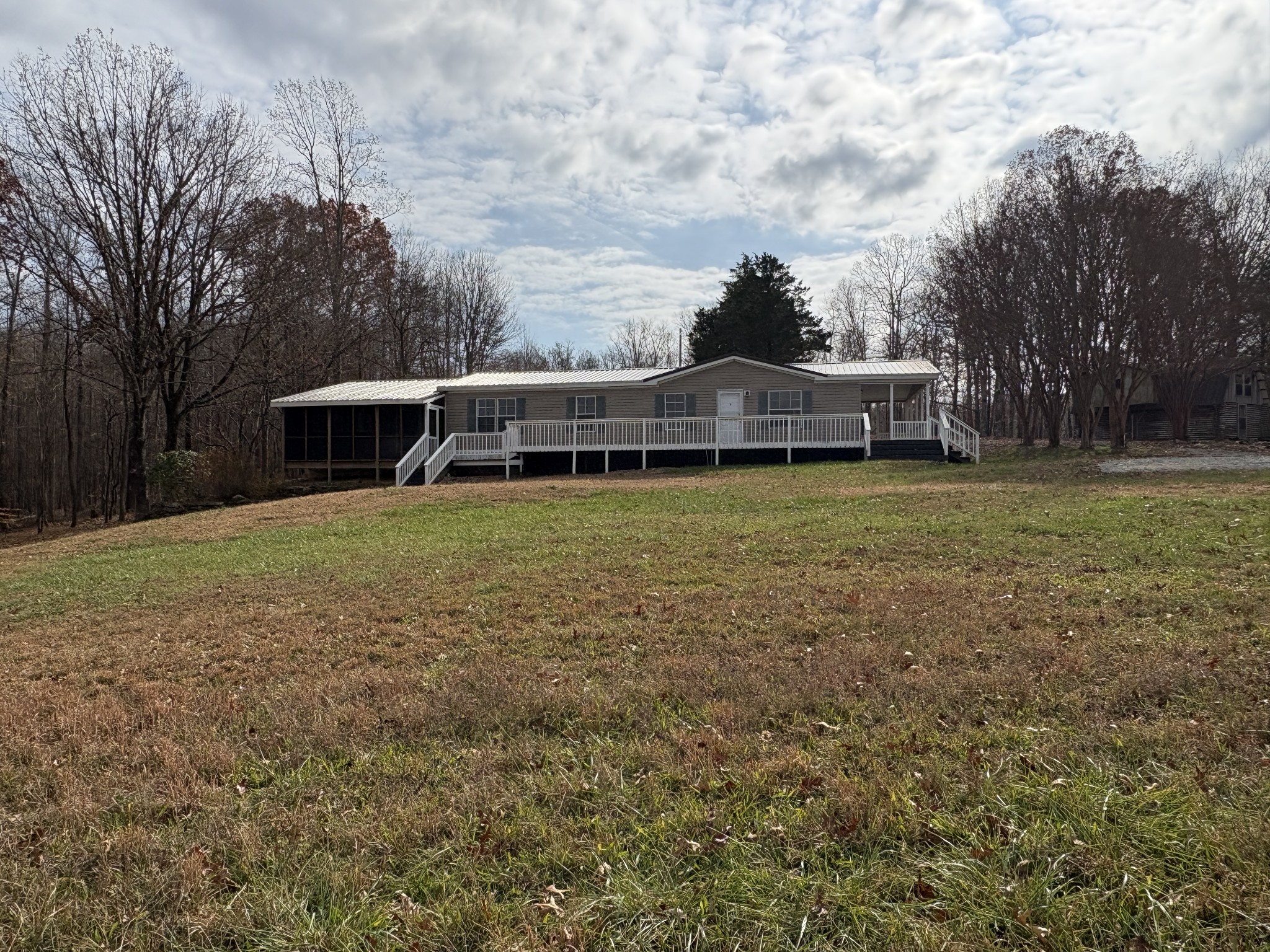 298 Leonard Jackson Road Waynesboro, TN 38485 - Photo 5 of 100 a view of a house with a yard and sitting area