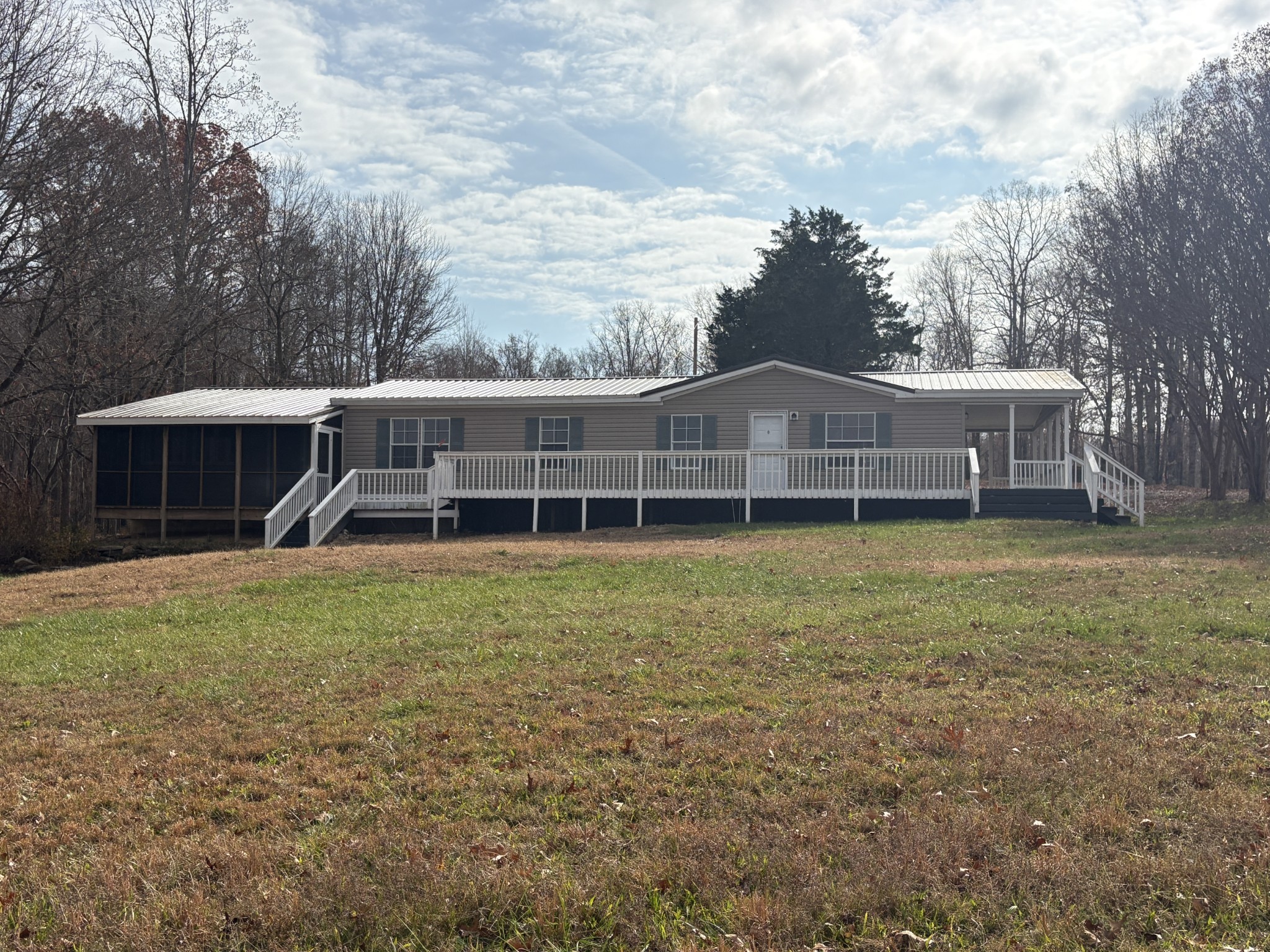 298 Leonard Jackson Road Waynesboro, TN 38485 - Photo 6 of 100 a front view of a house with a garden and trees