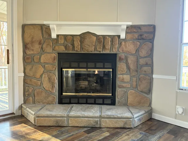 a kitchen with wooden floors and refrigerator