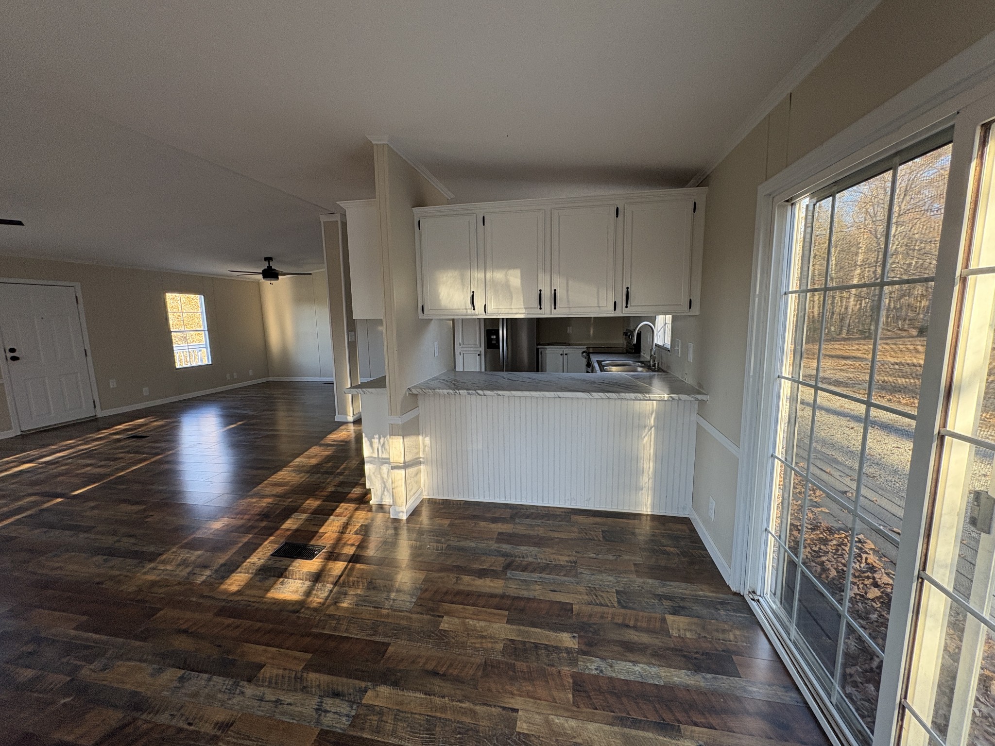 298 Leonard Jackson Road Waynesboro, TN 38485 - Photo 10 of 100 a kitchen with stainless steel appliances wooden floor and a window
