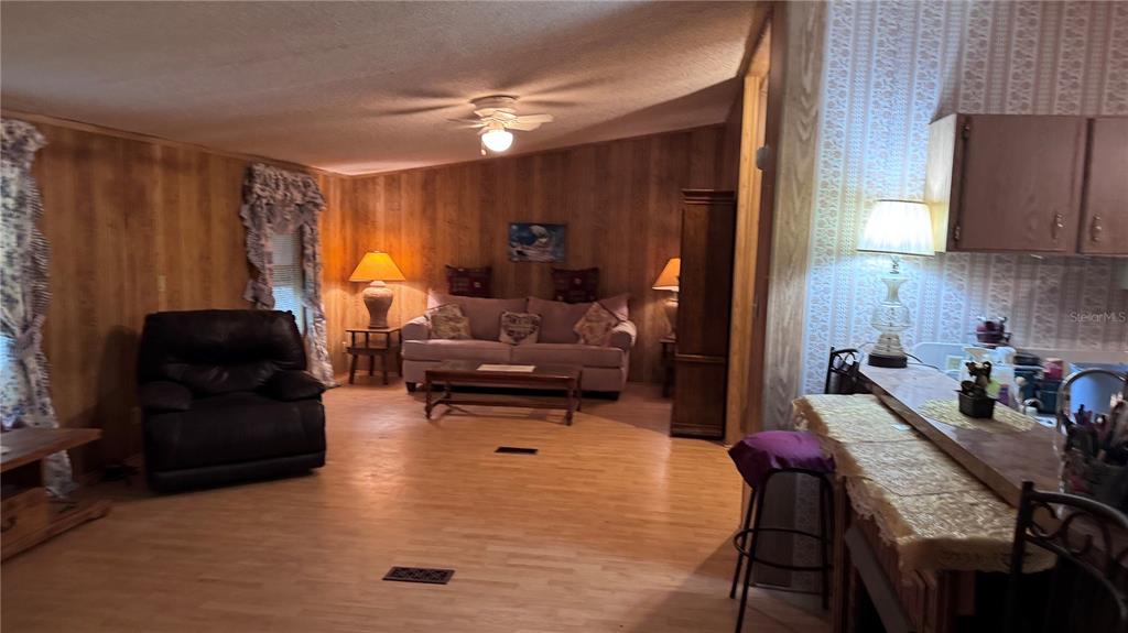20050 Ruth Street Brooksville, FL 34601 - Photo 10 of 18 a living room with furniture and a window