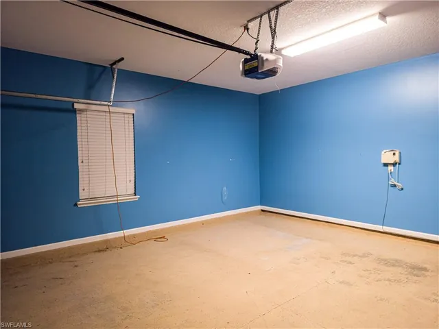 a view of a room with a ceiling fan