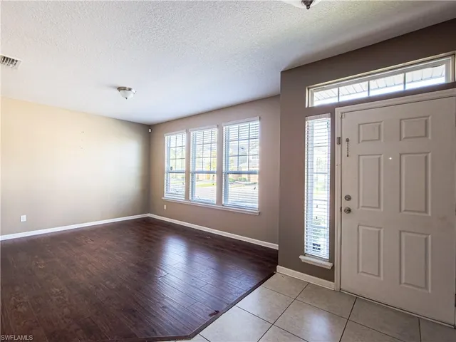 a view of an empty room with glass door