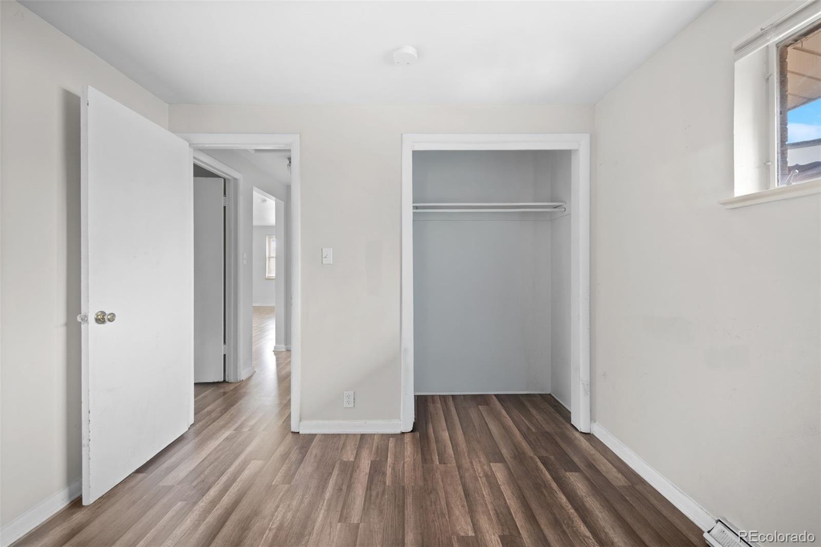 4785 Carr Street Wheat Ridge, CO 80033 - Photo 18 of 27 wooden floor in an empty room