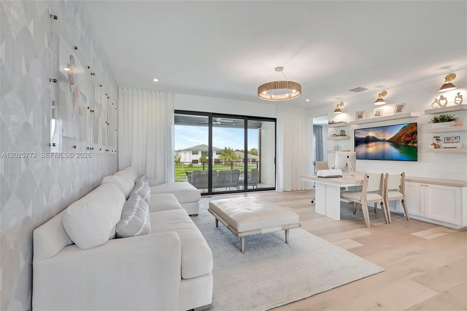 17023 Wandering Wave Avenue Boca Raton, FL 33496 - Photo 39 of 84 a living room with furniture and a large window