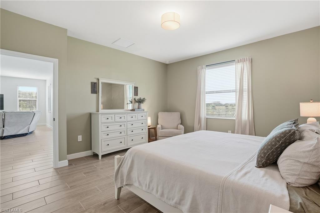 19306 Hinkley Drive Estero, FL 33928 - Photo 14 of 49 a bedroom with a bed and a view of bedroom
