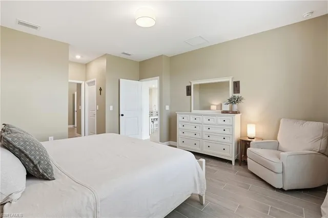 a bathroom with a double vanity sink and mirror
