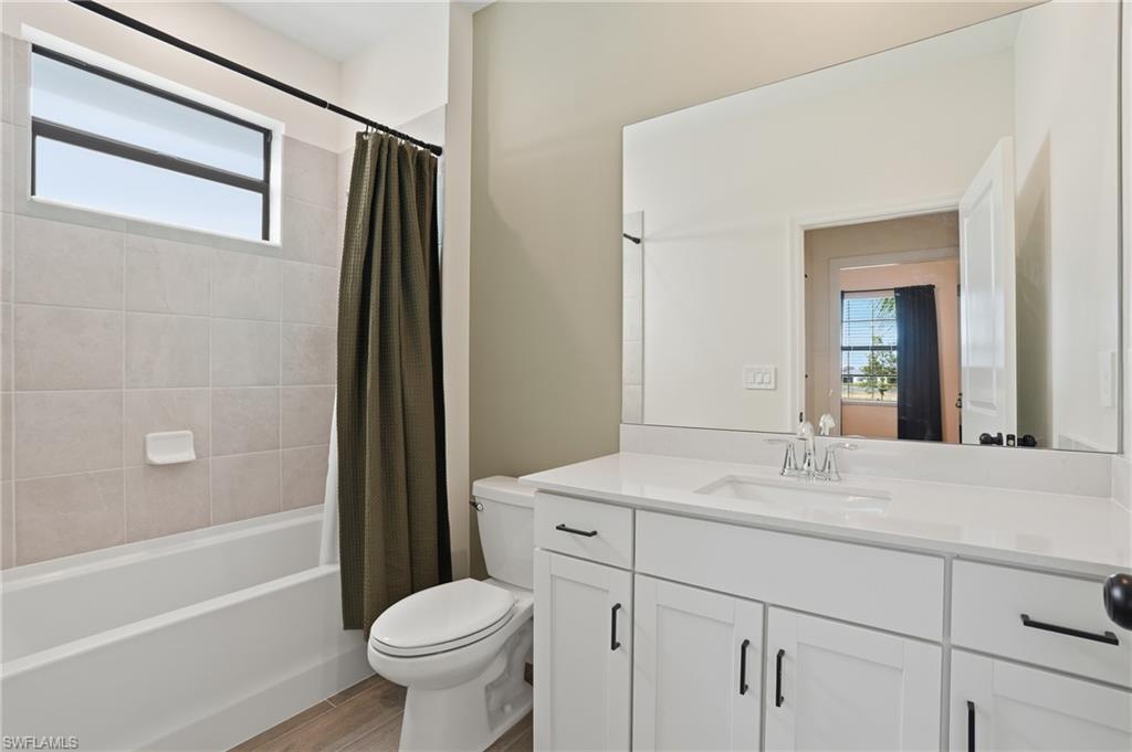 19306 Hinkley Drive Estero, FL 33928 - Photo 25 of 49 a bathroom with a sink toilet and shower