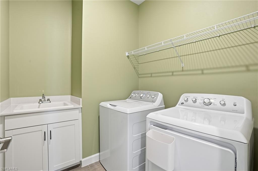 19306 Hinkley Drive Estero, FL 33928 - Photo 26 of 49 a utility room with dryer and washer
