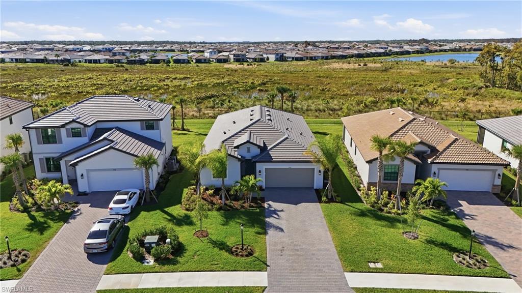 19306 Hinkley Drive Estero, FL 33928 - Photo 32 of 49 an aerial view of a house with a ocean view