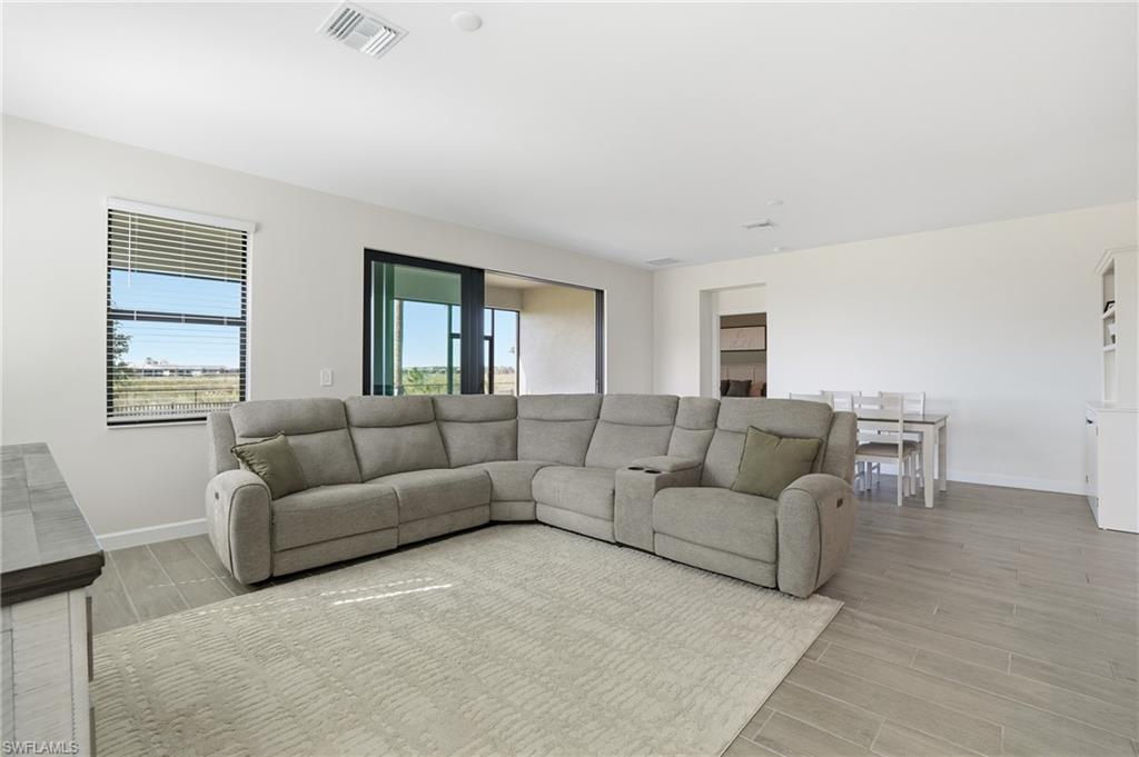 19306 Hinkley Drive Estero, FL 33928 - Photo 6 of 49 a living room with furniture and a window