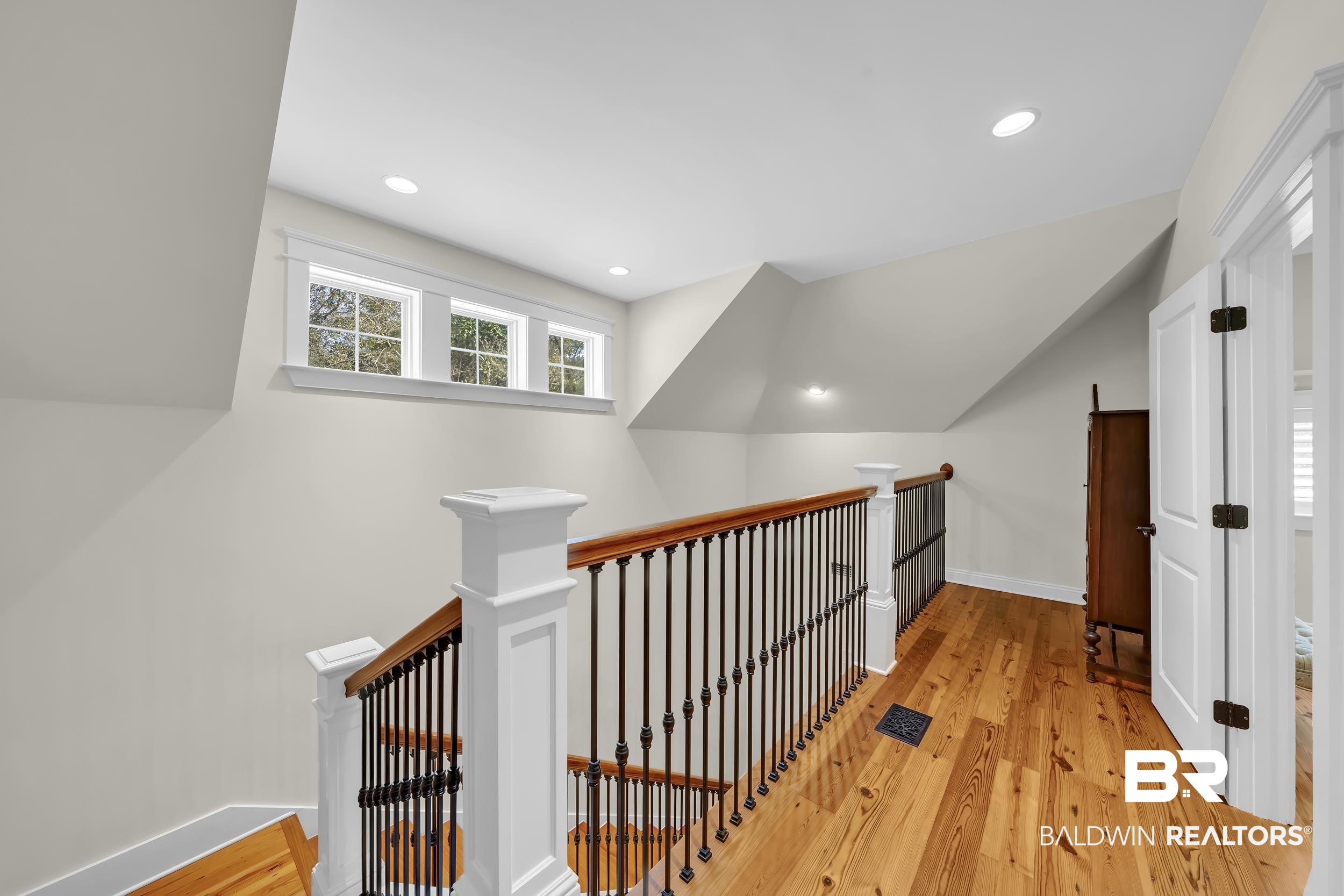 12161 Jessamine Street Magnolia Springs, AL 36555 - Photo 33 of 70 Corridor featuring light wood-style flooring, recessed lighting, an upstairs landing, and vaulted ceiling