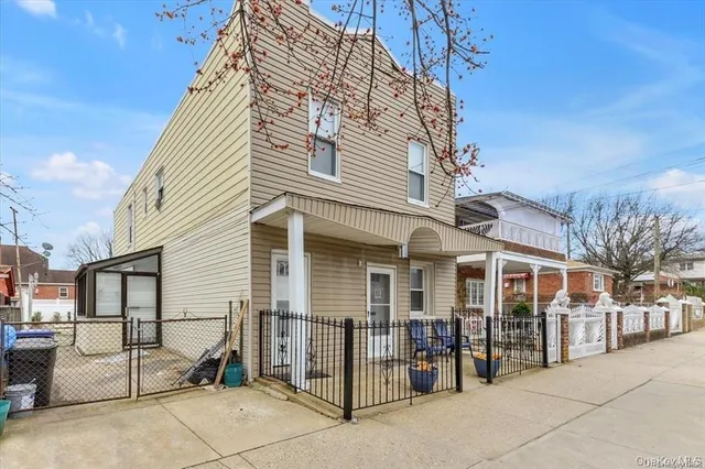 a view of a building with sitting area
