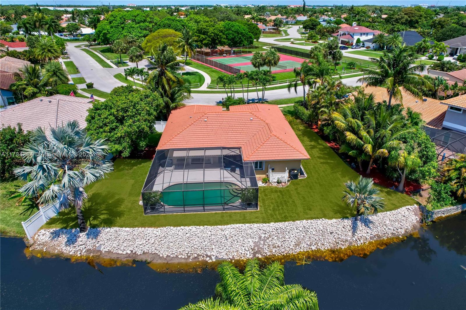 7260 Northwest 4th Avenue Boca Raton, FL 33487 - Photo 1 of 59 an aerial view of a house with a yard and lake view