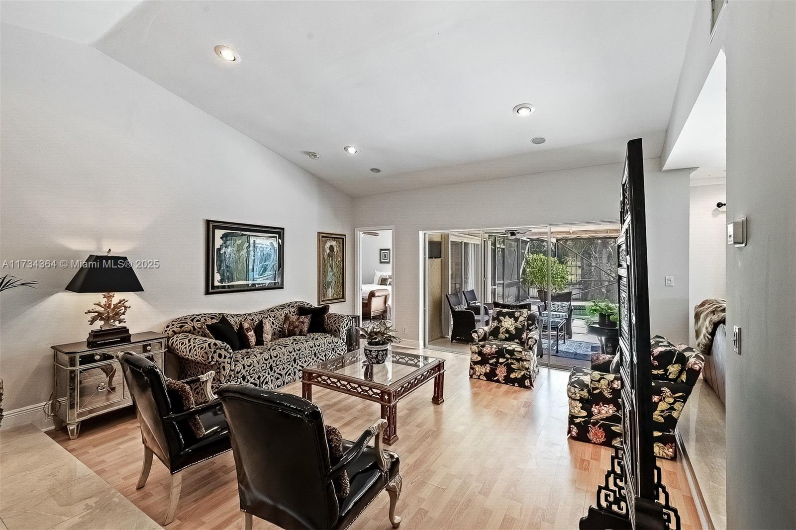 7260 Northwest 4th Avenue Boca Raton, FL 33487 - Photo 11 of 59 a living room with furniture and wooden floor