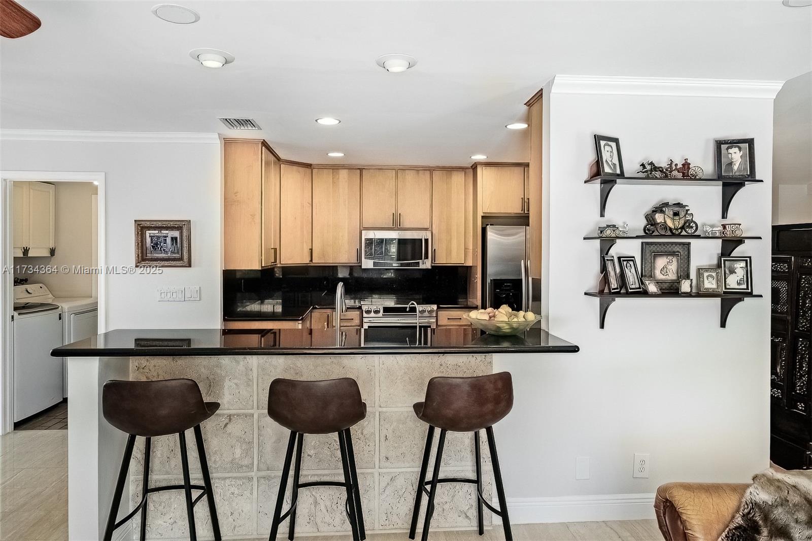 7260 Northwest 4th Avenue Boca Raton, FL 33487 - Photo 20 of 59 a kitchen with cabinets and chairs